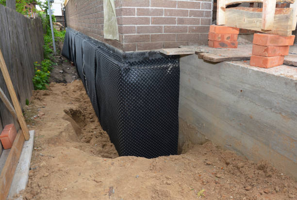 Happy homeowners after waterproofing job in Dundee